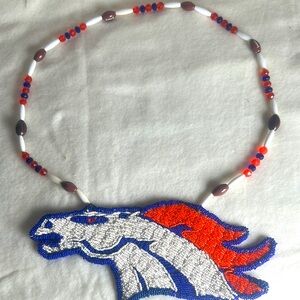 Handmade beaded Denver Bronco horse head with beaded necklace.